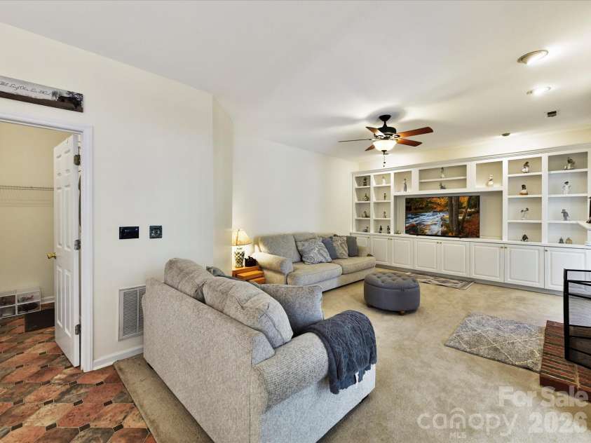4101 Saint Joseph Drive, Indian Trail, NC 28079.  MLS# CAR4374689, YatesRealty ID 18648. Family room with custom shelving