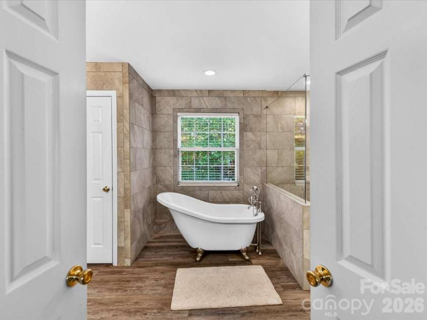 4101 Saint Joseph Drive, Indian Trail, NC 28079.  MLS# CAR4374689, YatesRealty ID 18648. French doors entering the primary bath