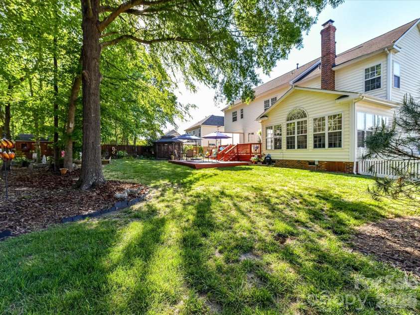 4101 Saint Joseph Drive, Indian Trail, NC 28079.  MLS# CAR4374689, YatesRealty ID 18648. Mature trees for shade
