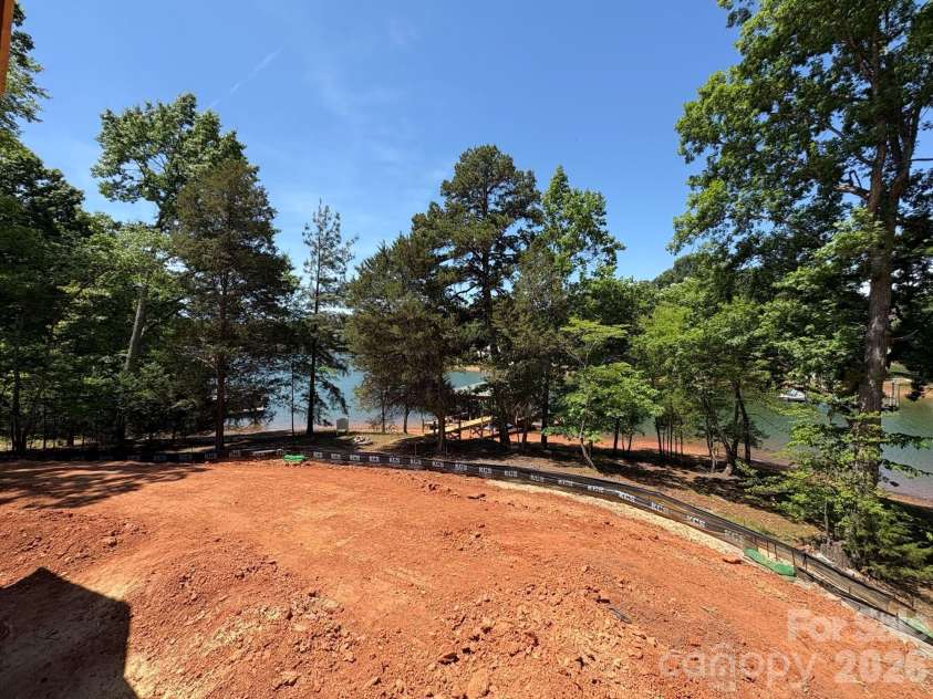 505 Kemp Road, Mooresville, NC 28117.  MLS# CAR4309698, YatesRealty ID 18649. Back yard view during construction