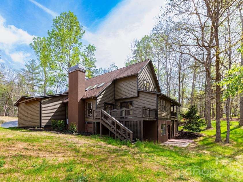 68 Sigmon Road, Fletcher, NC 28732.  MLS# CAR4336800, YatesRealty ID 18650. Spacious driveway and garage area with additional turnaround space—ideal for guests or multiple vehicles.