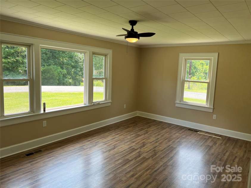 8095 New Street, Mount Pleasant, NC 28124.  MLS# CAR4264803, YatesRealty ID 18650. Large primary bedroom with lots of windows.