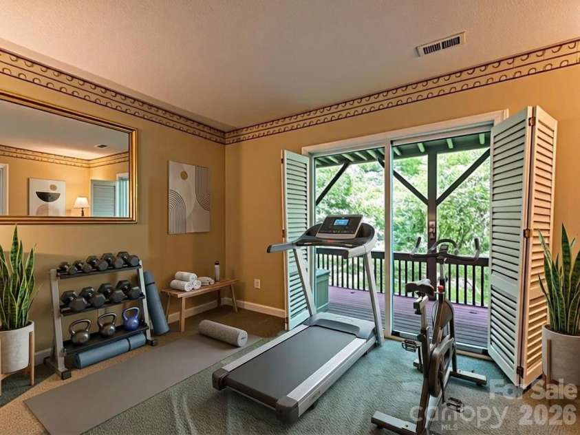 650 Creekside Drive, Maggie Valley, NC 28751.  MLS# CAR4335648, YatesRealty ID 18657. Basement suite has enough room for a variety of uses like this digitally staged gym