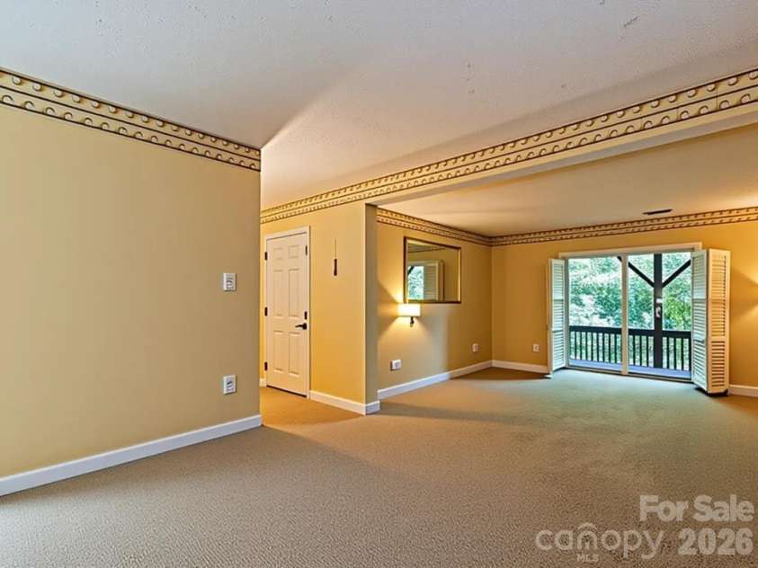 650 Creekside Drive, Maggie Valley, NC 28751.  MLS# CAR4335648, YatesRealty ID 18657. Empty Basement Suite 