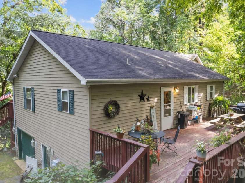 650 Creekside Drive, Maggie Valley, NC 28751.  MLS# CAR4335648, YatesRealty ID 18657. Rear deck with direct access from upper driveway. 