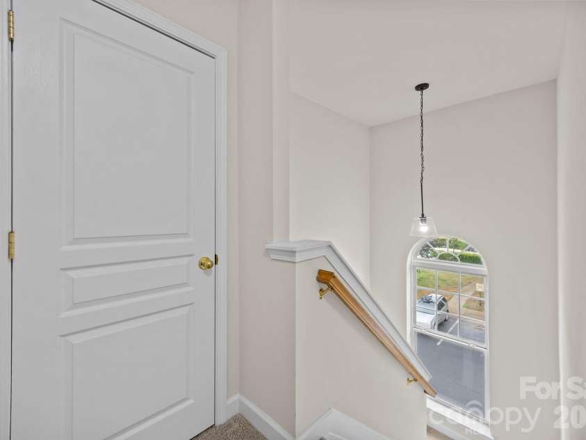 2750 Avalon Loop Road, Charlotte, NC 28269.  MLS# CAR4376282, YatesRealty ID 18660. 3rd level looking down to main level, linen closet or extra storage for you. 
