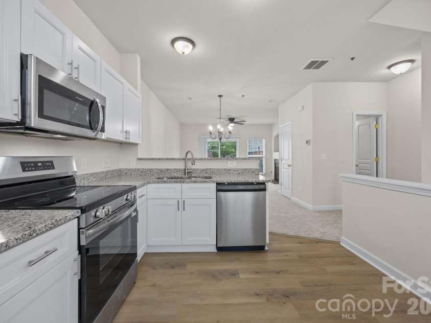 2750 Avalon Loop Road, Charlotte, NC 28269.  MLS# CAR4376282, YatesRealty ID 18660. All new and ready for YOU! New cabinets, lighting &  flooring. Spacious enough for friends and a small breakfast table. 