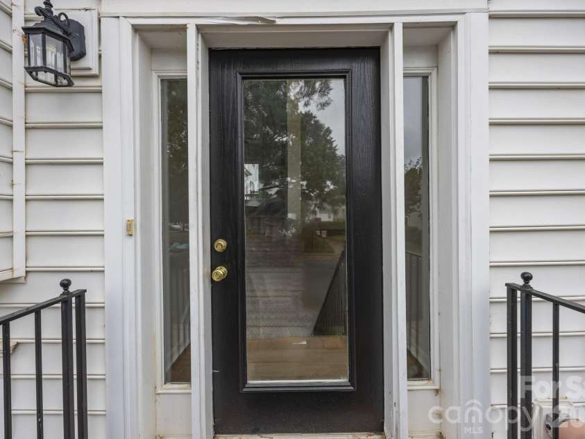2750 Avalon Loop Road, Charlotte, NC 28269.  MLS# CAR4376282, YatesRealty ID 18660. Front door entrance