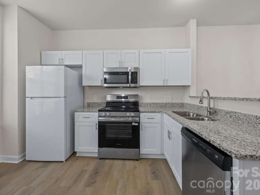 2750 Avalon Loop Road, Charlotte, NC 28269.  MLS# CAR4376282, YatesRealty ID 18660. New: cabinets, countertops, appliances, floors and blinds. 