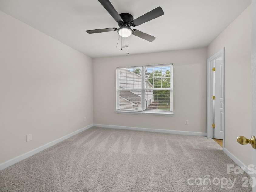 2750 Avalon Loop Road, Charlotte, NC 28269.  MLS# CAR4376282, YatesRealty ID 18660. Owner's Suite has double windows for natural light, new blinds, ceiling fan. 