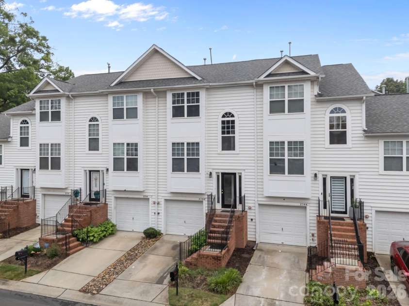 2750 Avalon Loop Road, Charlotte, NC 28269.  MLS# CAR4376282, YatesRealty ID 18660. The townhome for sell is in the middle! 