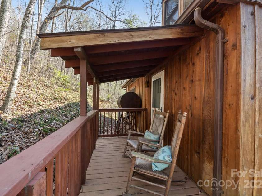573 Countryside Drive, Waynesville, NC 28785.  MLS# CAR4244460, YatesRealty ID 18661. Covered Deck Lounging Area