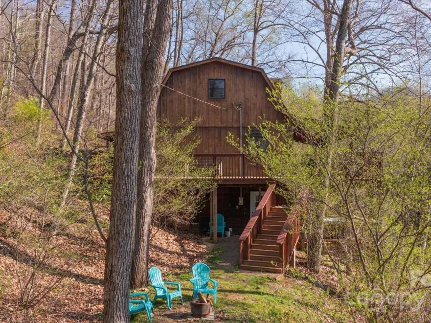 573 Countryside Drive, Waynesville, NC 28785.  MLS# CAR4244460, YatesRealty ID 18661. Fire pit in Side Yard