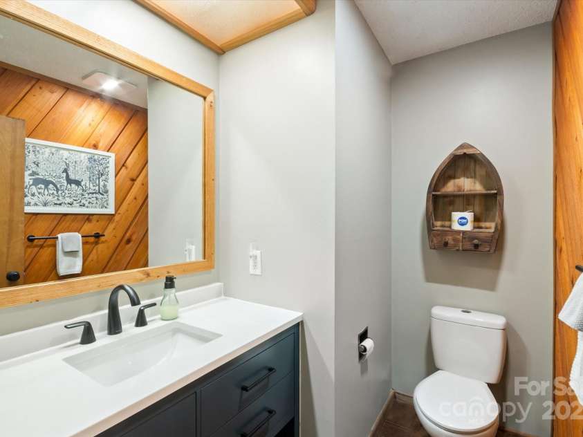 573 Countryside Drive, Waynesville, NC 28785.  MLS# CAR4244460, YatesRealty ID 18661. Half Bath Downstairs