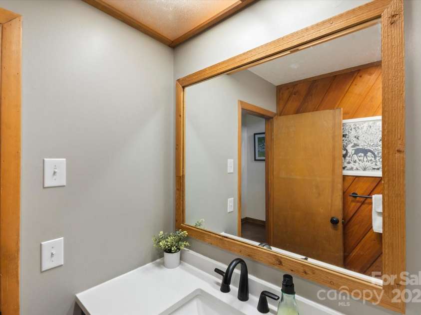 573 Countryside Drive, Waynesville, NC 28785.  MLS# CAR4244460, YatesRealty ID 18661. Half Bath Downstairs