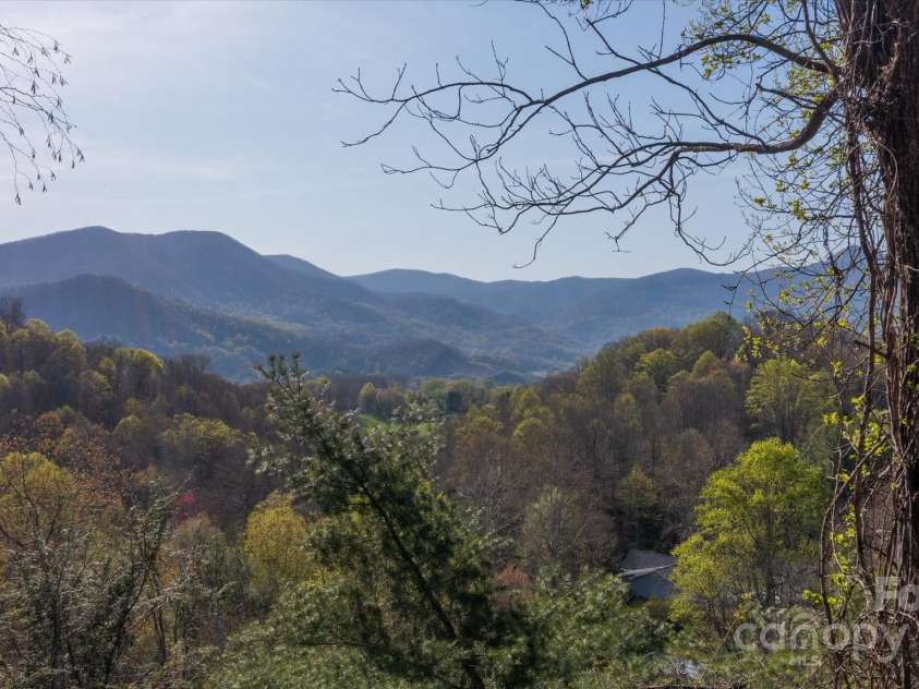 573 Countryside Drive, Waynesville, NC 28785.  MLS# CAR4244460, YatesRealty ID 18661. Stunning Long-range Mountain Views