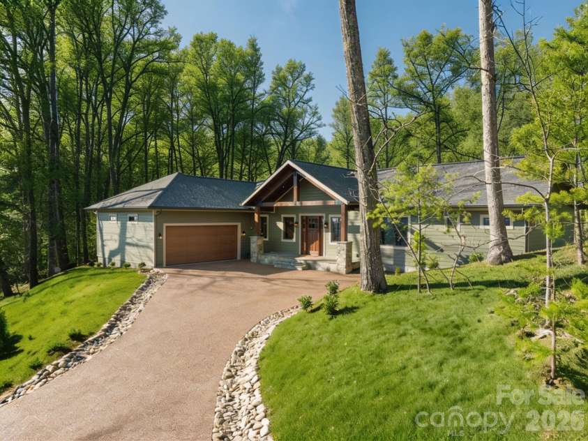 296 Austin Mountain Drive, Burnsville, NC 28714.  MLS# CAR4360900, YatesRealty ID 18662. Grass and trees are virtually edited