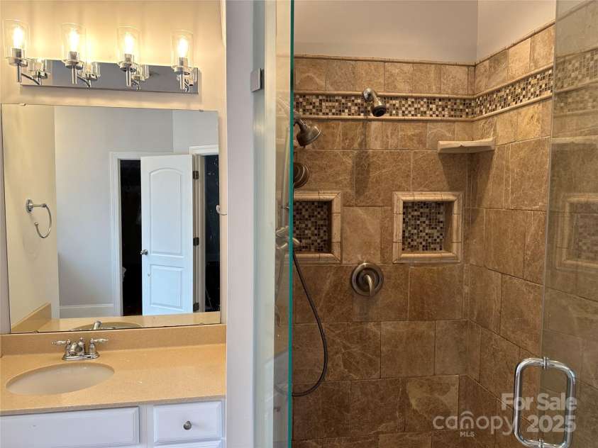 10715 Tom Short Road, Charlotte, NC 28277.  MLS# CAR4263711, YatesRealty ID 18666. Primary Bathroom - Large walkin shower with Italian Marble - Dual Shower heads
