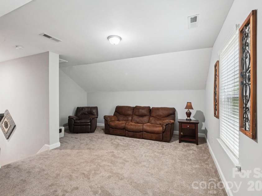 589 Newport Drive, Mount Gilead, NC 27306.  MLS# CAR4306770, YatesRealty ID 18667. Flex space over garage.