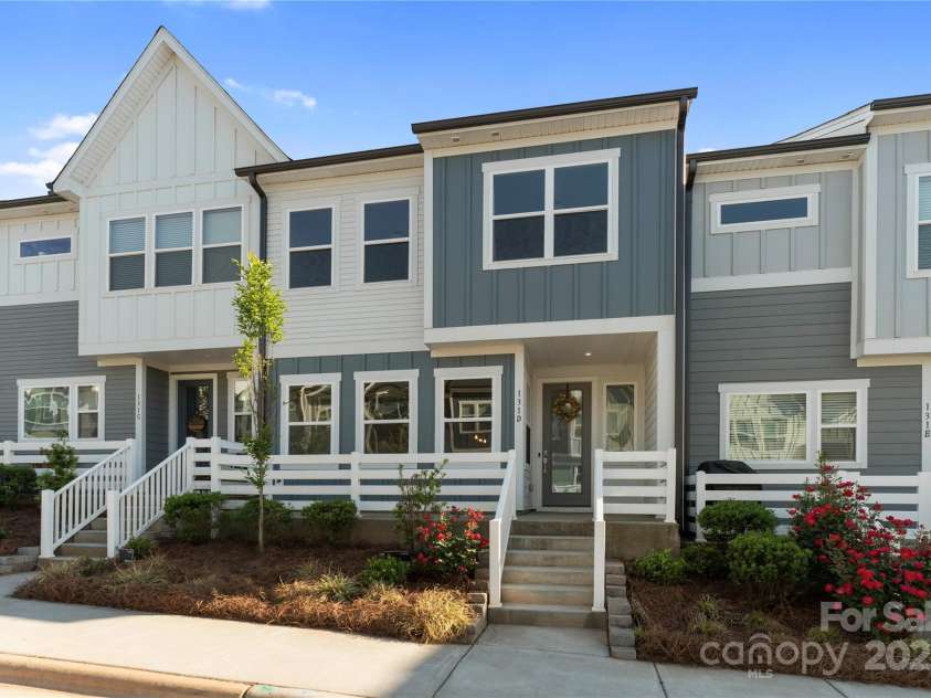 131 Berkeley Avenue, Mooresville, NC 28117.  MLS# CAR4249397, YatesRealty ID 18668. Front of home with lovely rocking chair front porch!