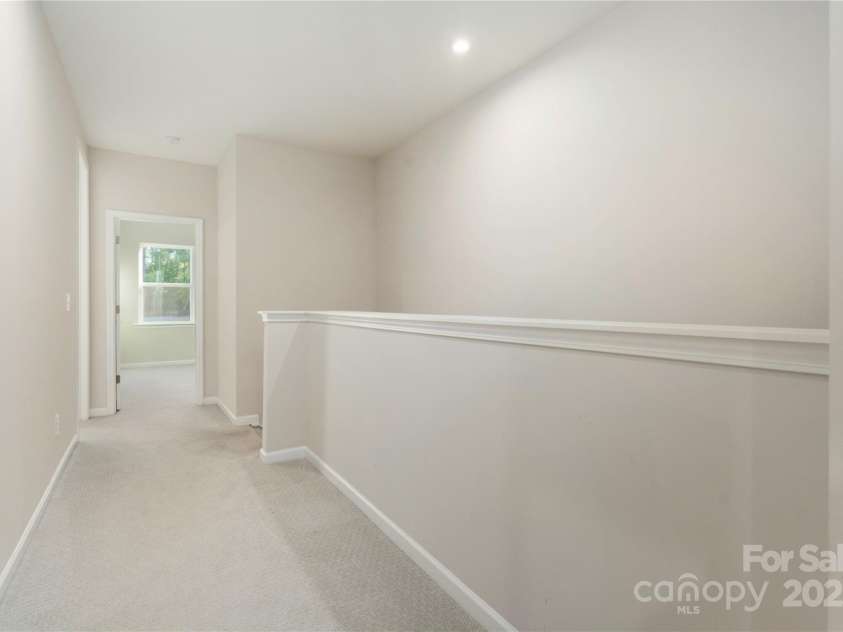 131 Berkeley Avenue, Mooresville, NC 28117.  MLS# CAR4249397, YatesRealty ID 18668. Upstairs hallway leading to four bedrooms.