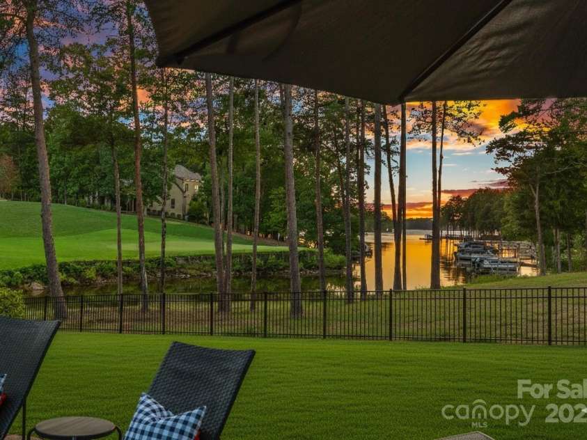 143 Jeremy Point Place, Mooresville, NC 28117.  MLS# CAR4307571, YatesRealty ID 18672. Gorgeous Sunset View of Lake Norman & Trump National Golf Club