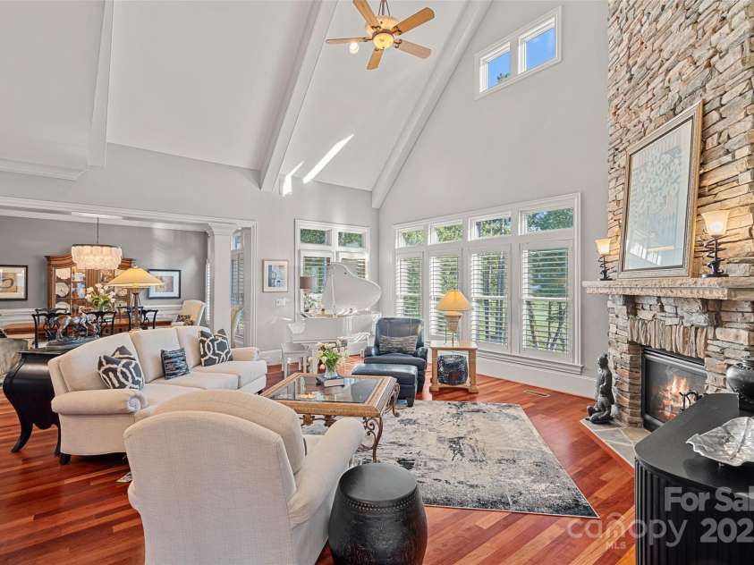 143 Jeremy Point Place, Mooresville, NC 28117.  MLS# CAR4307571, YatesRealty ID 18672. Vaulted Great Room w/ Stacked Stone Fireplace