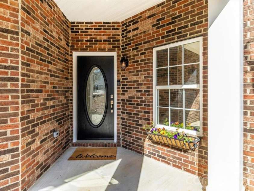 241 Loch Stone Street, Fort Mill, SC 29715.  MLS# CAR4334932, YatesRealty ID 18680. Front entryway 