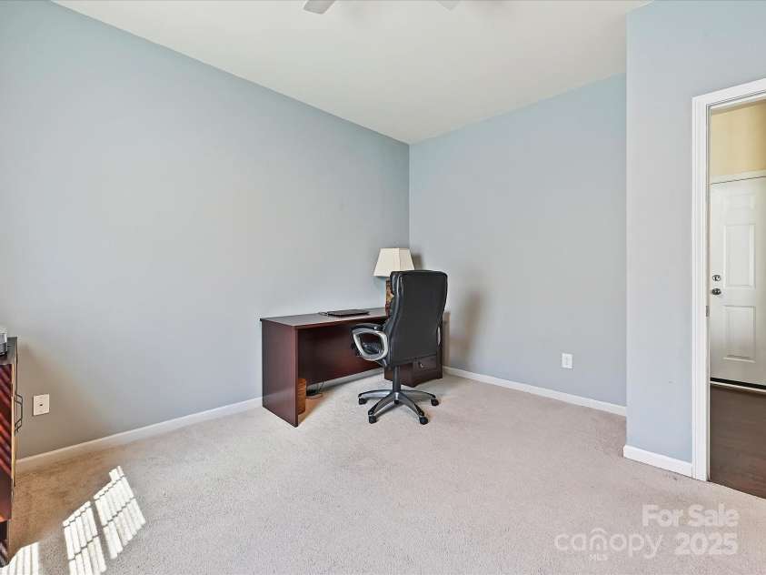 11621 Red Knoll Lane, Pineville, NC 28134.  MLS# CAR4238844, YatesRealty ID 18689. Downstairs back Office with adjacent 1/2 bath