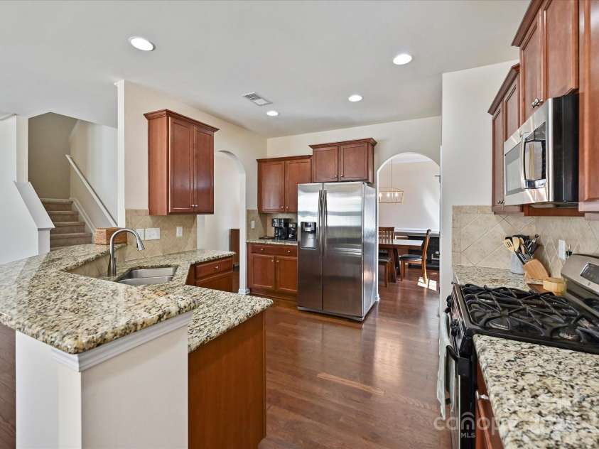 11621 Red Knoll Lane, Pineville, NC 28134.  MLS# CAR4238844, YatesRealty ID 18689. Kitchen open to Dining Room