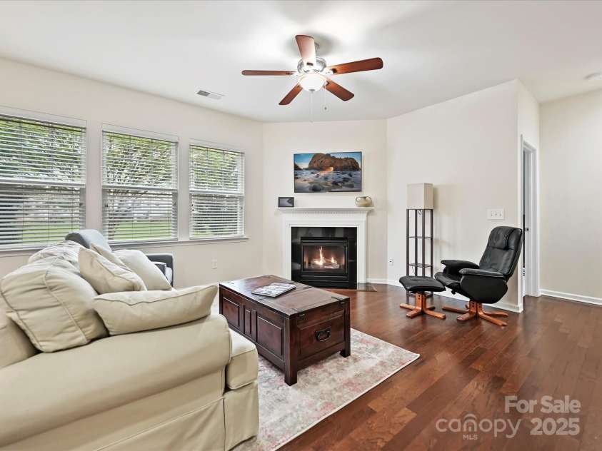 11621 Red Knoll Lane, Pineville, NC 28134.  MLS# CAR4238844, YatesRealty ID 18689. Light-filled Great Room with gas log fireplace