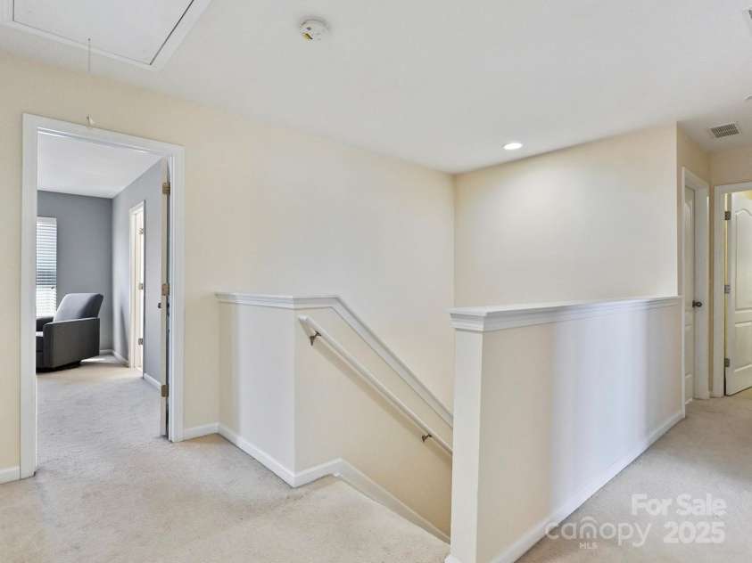 11621 Red Knoll Lane, Pineville, NC 28134.  MLS# CAR4238844, YatesRealty ID 18689. Wide landing upstairs