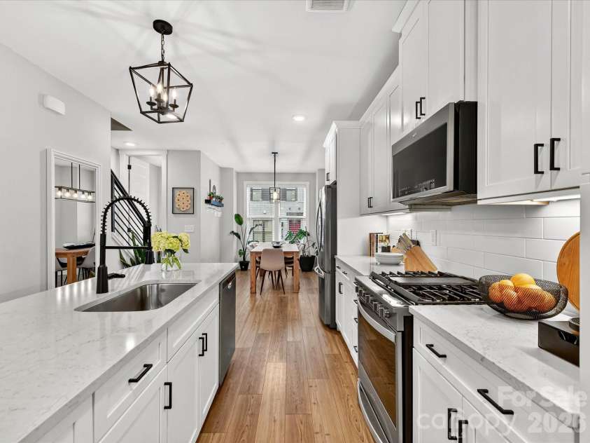 2024 Terwilliger Terrace, Charlotte, NC 28203.  MLS# CAR4354818, YatesRealty ID 18690. Kitchen Facing Dining Room