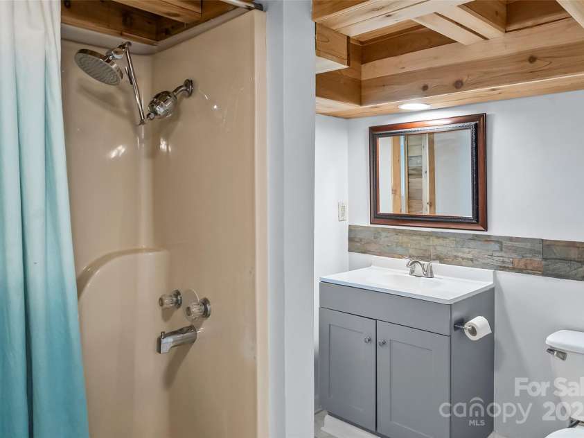 7 Olivewood Drive, Asheville, NC 28805.  MLS# CAR4260130, YatesRealty ID 18690. Downstairs Bathroom