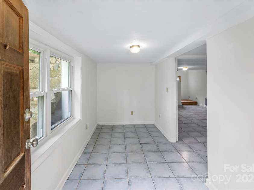 7 Olivewood Drive, Asheville, NC 28805.  MLS# CAR4260130, YatesRealty ID 18690. Flex Area Downstairs