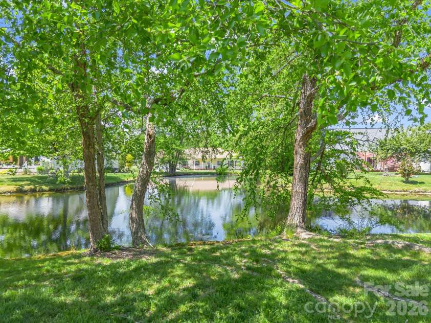 179 Kingfisher Lane, Mills River, NC 28759.  MLS# CAR4371659, YatesRealty ID 18691. Pond in backyard
