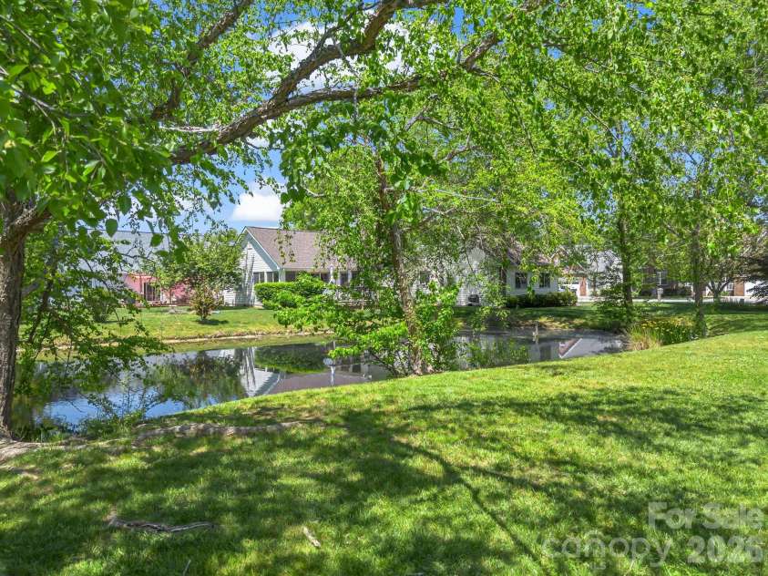 179 Kingfisher Lane, Mills River, NC 28759.  MLS# CAR4371659, YatesRealty ID 18691. Pond in backyard