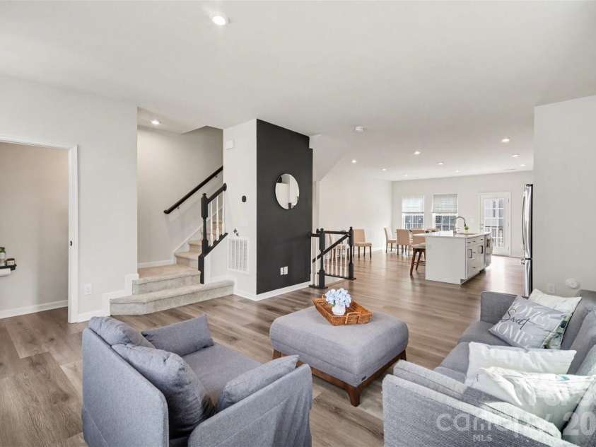 1211 May Apple Drive, Matthews, NC 28104.  MLS# CAR4349780, YatesRealty ID 18695. Bright open-concept living area that flows into the modern kitchen
