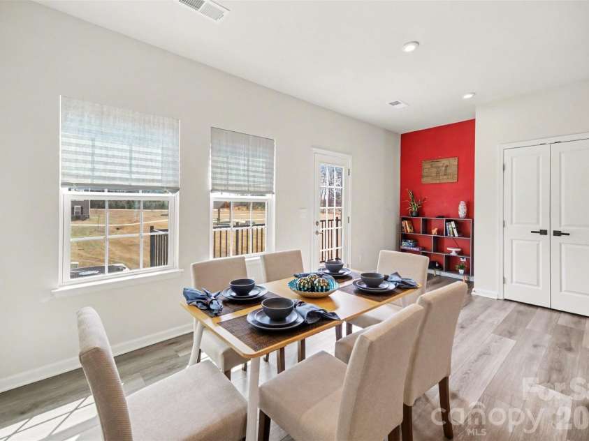 1211 May Apple Drive, Matthews, NC 28104.  MLS# CAR4349780, YatesRealty ID 18695. Dining space flows into a nook area and pantry closet.