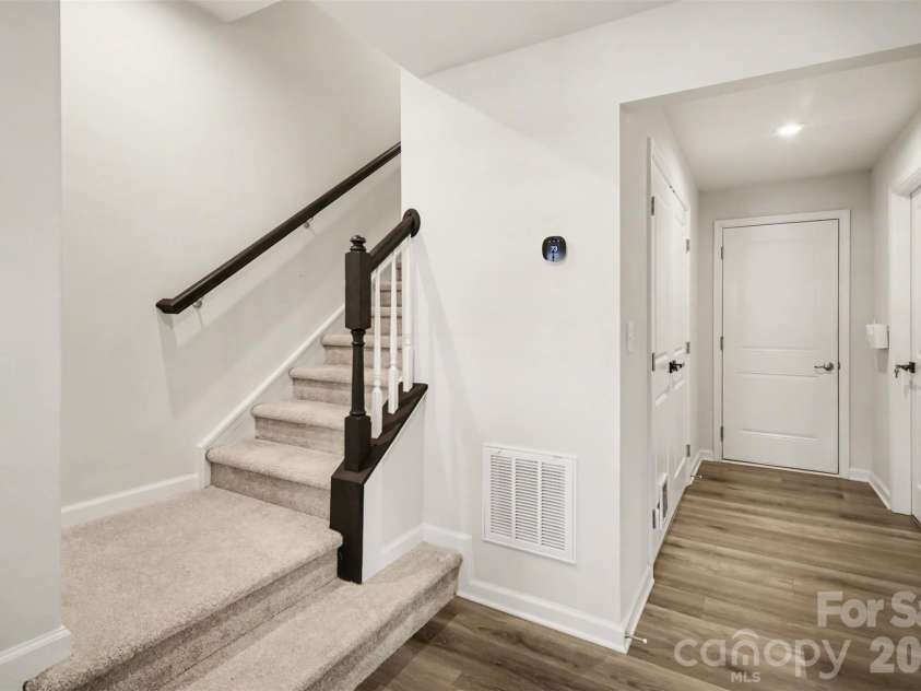 1211 May Apple Drive, Matthews, NC 28104.  MLS# CAR4349780, YatesRealty ID 18695. Nice LVP on the first floor & stairs leading to 2nd floor