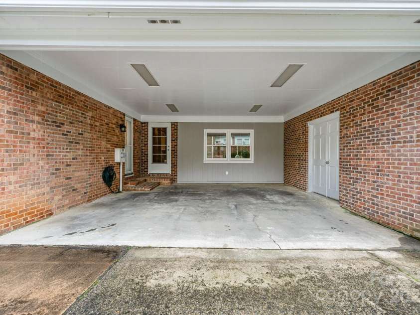 1209 Alfred Street, Charlotte, NC 28211.  MLS# CAR4252796, YatesRealty ID 18696. Attached car port