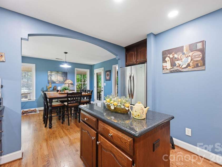 145 Upper Spencer Mountain Road, Stanley, NC 28164.  MLS# CAR4378025, YatesRealty ID 18703. A view from the Kitchen into the Breakfast room...