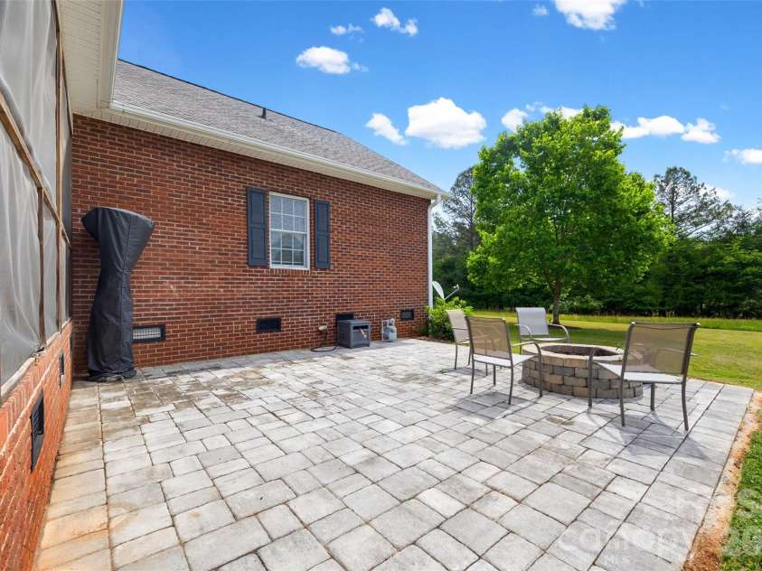 738 Costner School Road, Bessemer City, NC 28016.  MLS# CAR4373154, YatesRealty ID 18704. Paver Patio w/Firepit