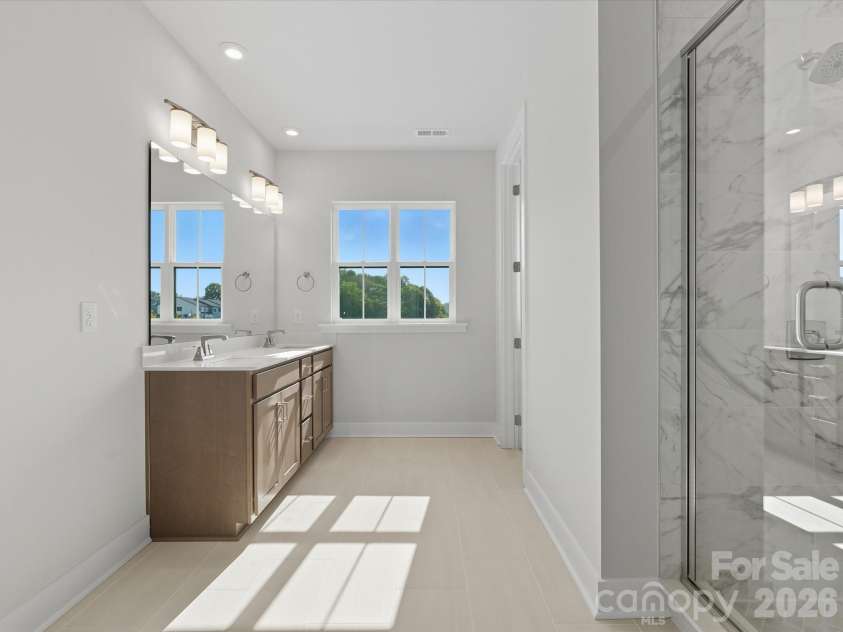 323 Ardmore Drive, Belmont, NC 28012.  MLS# CAR4378227, YatesRealty ID 18709. Light filled primary bathroom