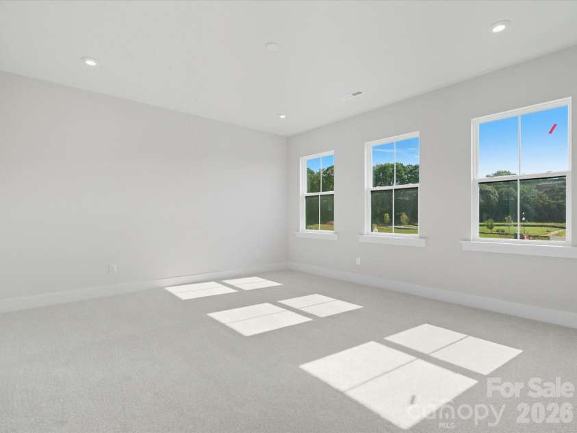 323 Ardmore Drive, Belmont, NC 28012.  MLS# CAR4378227, YatesRealty ID 18709. Light filled primary bedroom