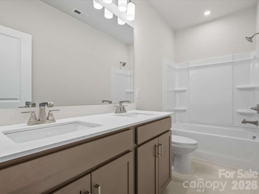 323 Ardmore Drive, Belmont, NC 28012.  MLS# CAR4378227, YatesRealty ID 18709. Secondary dual vanity bathroom