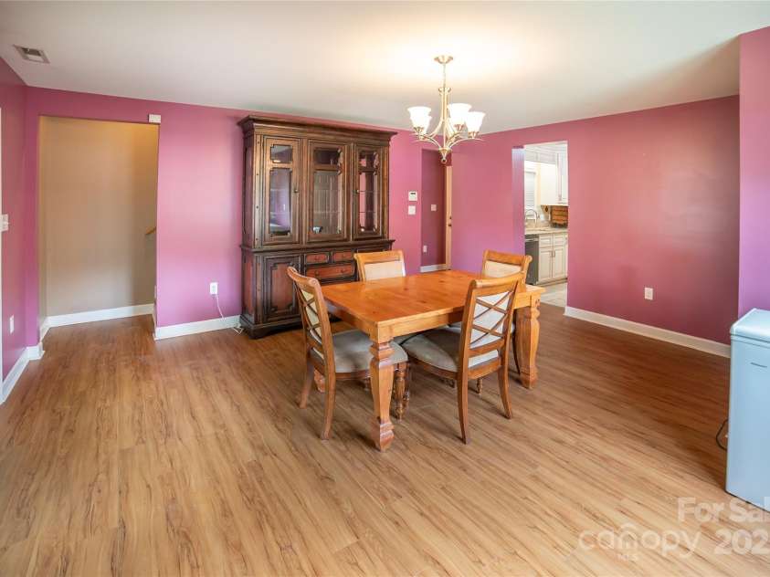 2411 Allendale Circle, Lenoir, NC 28645.  MLS# CAR4265888, YatesRealty ID 18717. Large dining room leading to back porch