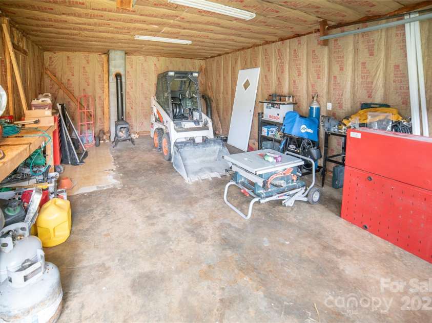 2411 Allendale Circle, Lenoir, NC 28645.  MLS# CAR4265888, YatesRealty ID 18717. Workshop with electrical and woodstove