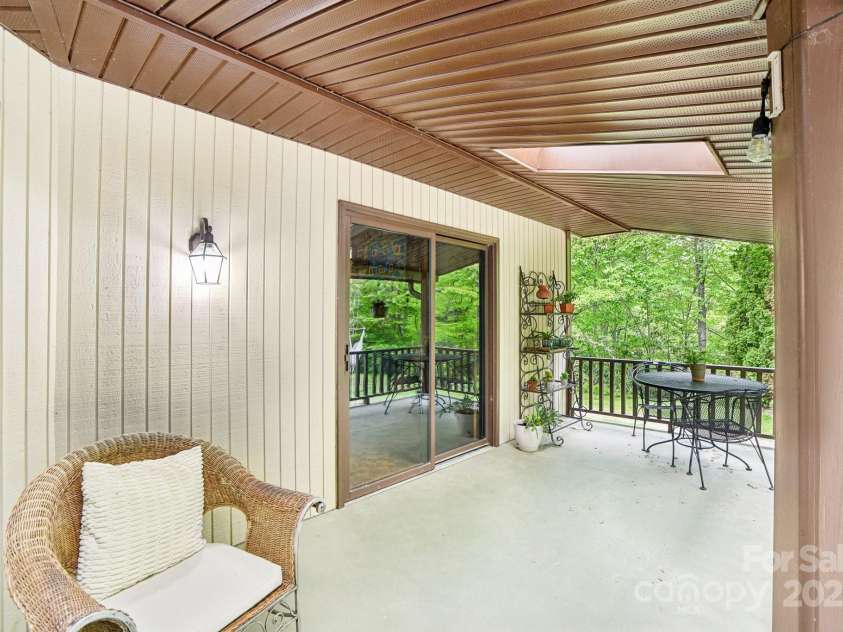 675 Terrys Gap Road, Hendersonville, NC 28792.  MLS# CAR4253126, YatesRealty ID 18724. Home offers several sliding glass doors throughout for easy outside access