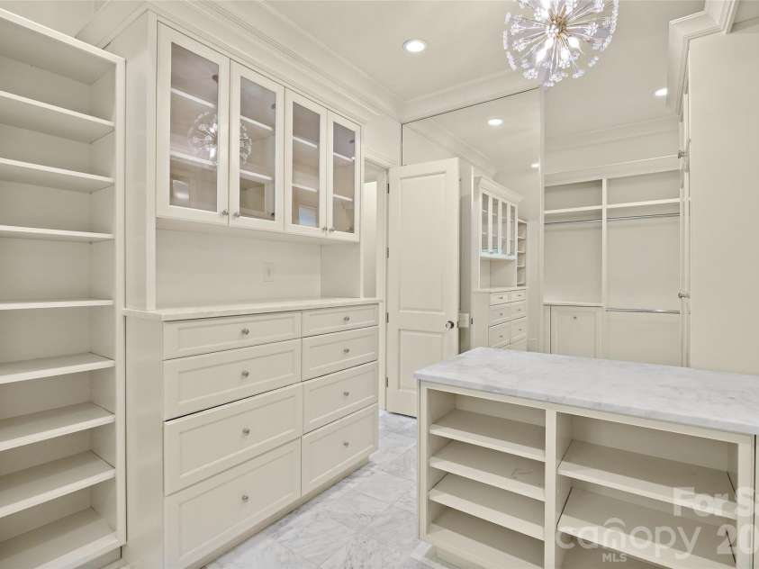 4536 Parview Drive, Charlotte, NC 28226.  MLS# CAR4376989, YatesRealty ID 18729. His and her primary bathrooms & closets